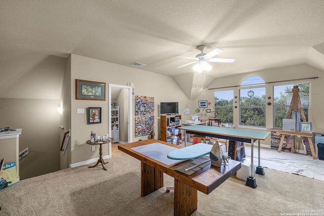 game room with ceiling fan, carpet flooring, vaulted ceiling, and a textured ceiling