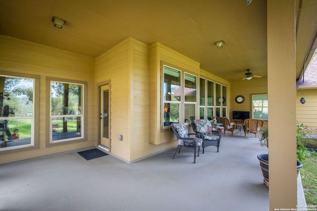 view of patio / terrace with an outdoor living space and ceiling fan