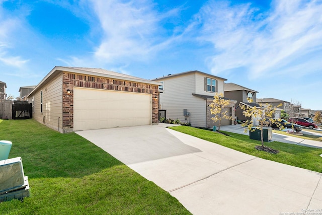 view of front of home featuring a garage and a front lawn