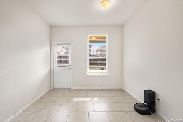 empty room featuring light tile patterned floors