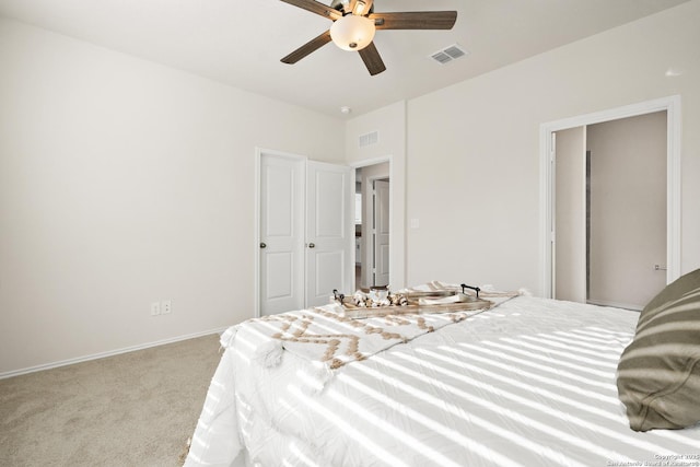 bedroom with light colored carpet and ceiling fan