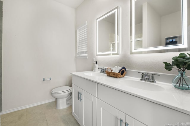 bathroom featuring vanity, toilet, and tile patterned flooring