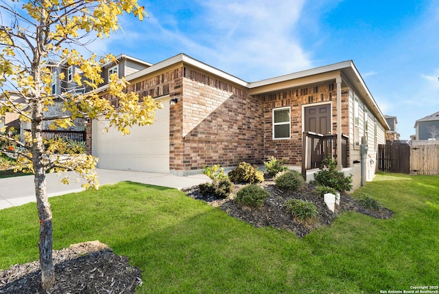 view of front of property with a garage and a front lawn