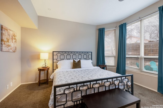 bedroom featuring dark colored carpet