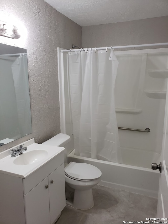 full bathroom with vanity, shower / bath combo, toilet, and a textured ceiling