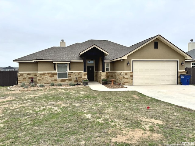 view of front of house featuring a garage and a front yard