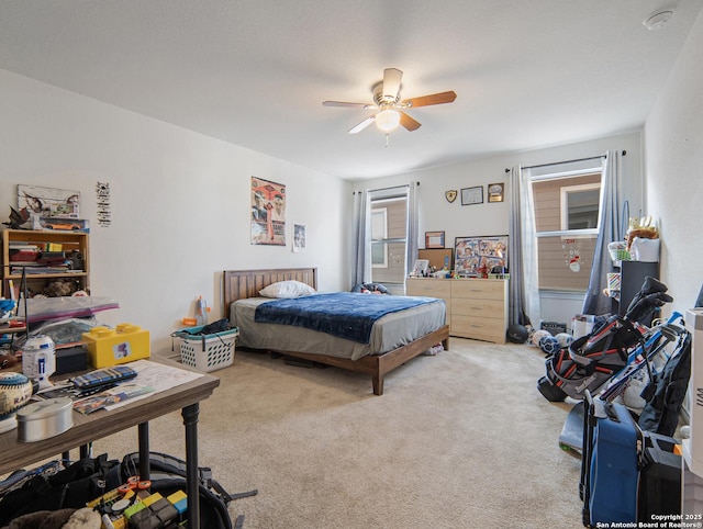 bedroom with light colored carpet and ceiling fan