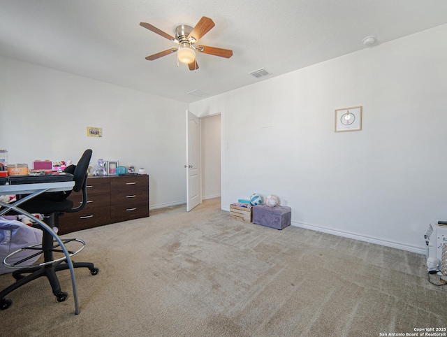 carpeted home office with ceiling fan