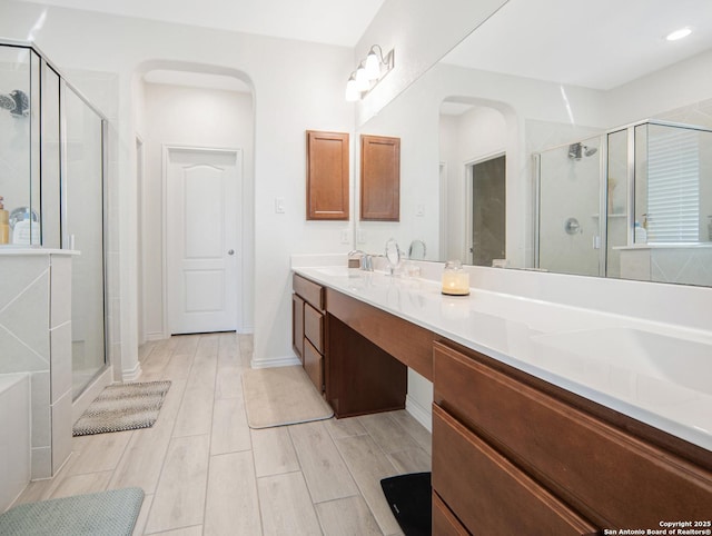 bathroom with vanity and an enclosed shower