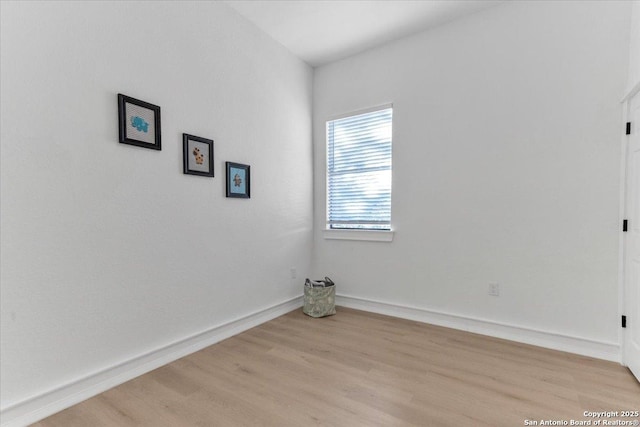 spare room featuring light wood-type flooring