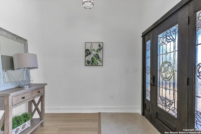 foyer entrance featuring light wood-type flooring