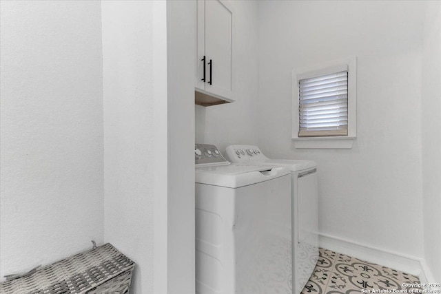 washroom featuring cabinets, light tile patterned floors, and independent washer and dryer