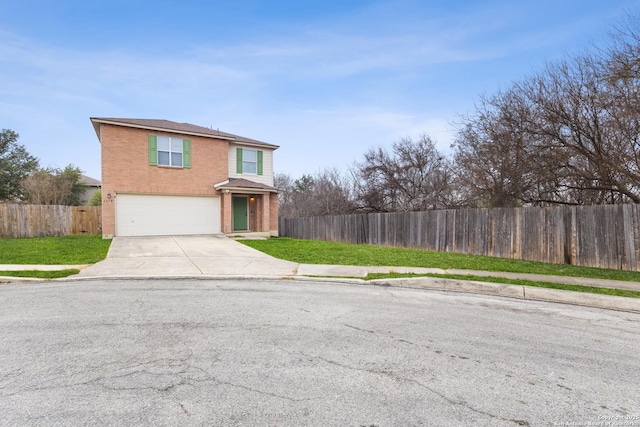 front facade featuring a garage and a front lawn