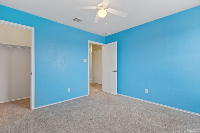 unfurnished bedroom featuring a closet, ceiling fan, and carpet flooring