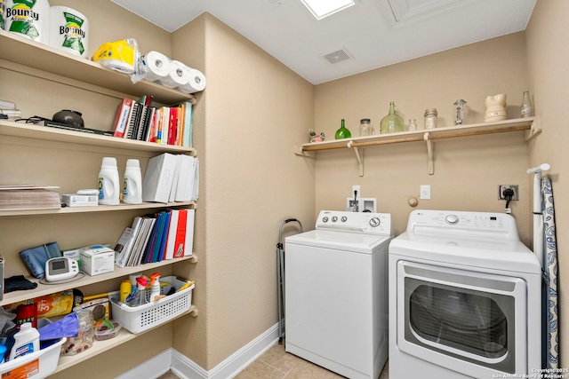 washroom with washer and dryer