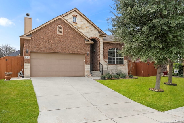 view of front of property featuring a garage and a front yard