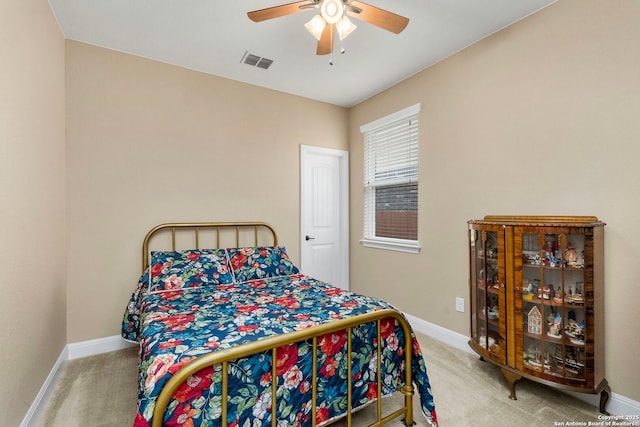 bedroom with ceiling fan and carpet floors