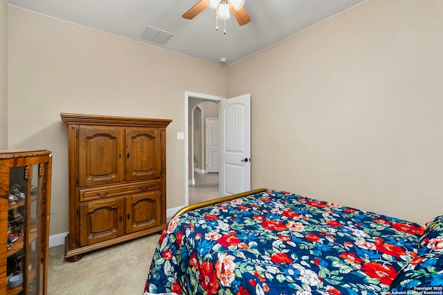 bedroom featuring ceiling fan and light colored carpet