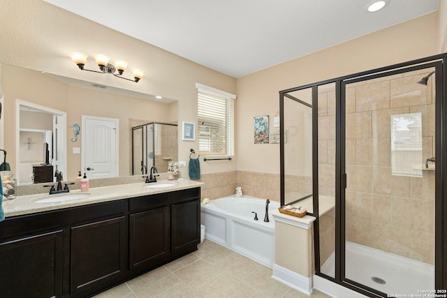 bathroom featuring vanity, tile patterned flooring, and independent shower and bath