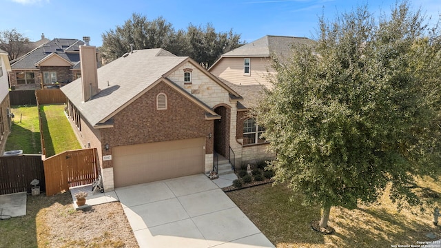 view of front facade with a garage and a front lawn