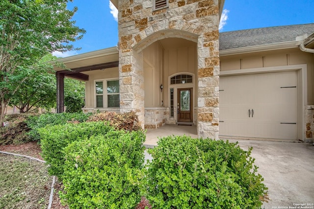 entrance to property featuring a garage