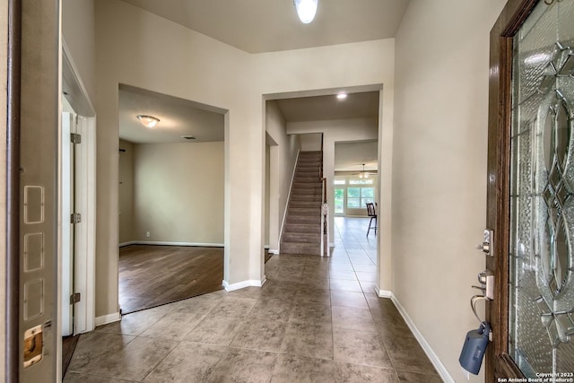 foyer entrance with light tile patterned floors