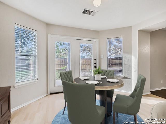 dining area featuring light wood-type flooring