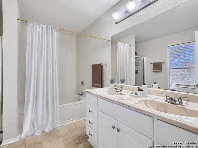 bathroom featuring vanity, shower / bath combination with curtain, and tile patterned floors