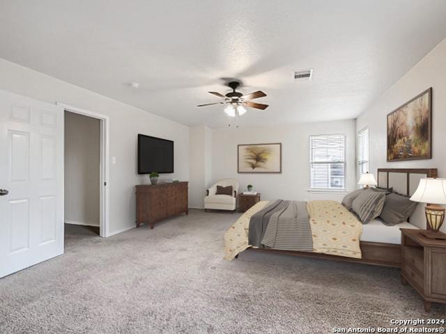 carpeted bedroom featuring ceiling fan