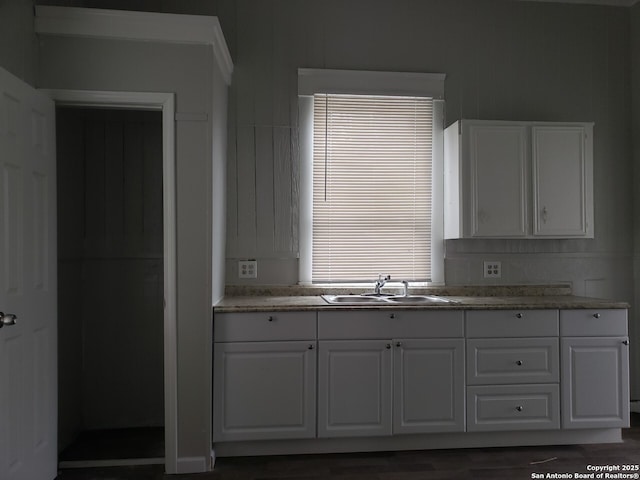 916 5th St, Orange, TX 77630 - kitchen with white cabinetry and sink