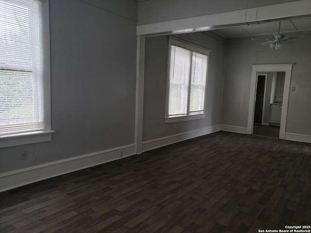 916 5th St, Orange, TX 77630 - unfurnished room with dark hardwood / wood-style floors and ceiling fan