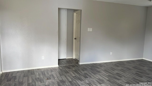 empty room featuring dark hardwood / wood-style flooring