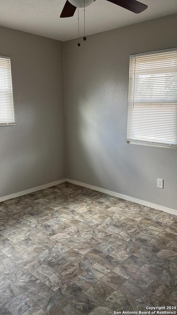 empty room with ceiling fan