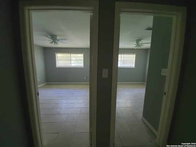 unfurnished room with ceiling fan