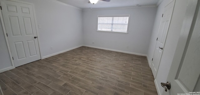 unfurnished bedroom featuring crown molding and wood-type flooring