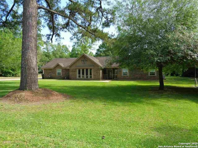 ranch-style house with a front lawn