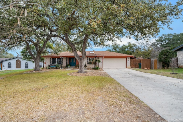 ranch-style house with a garage and a front yard