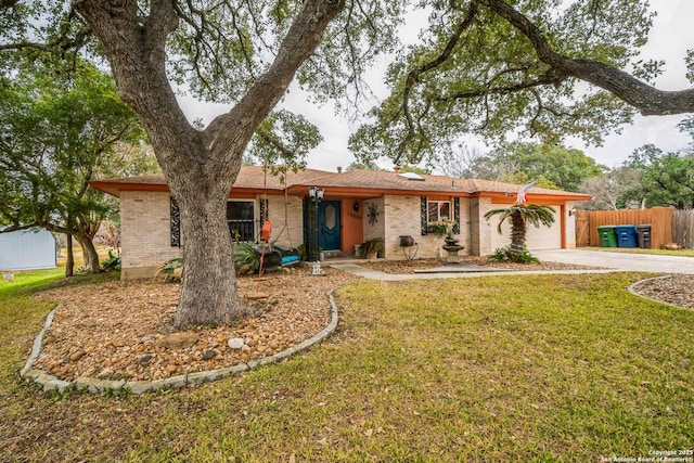 ranch-style house with a garage and a front lawn