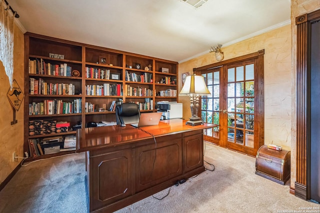 carpeted home office with crown molding and french doors