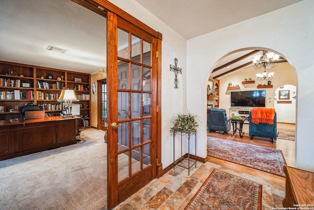 hall with vaulted ceiling with beams