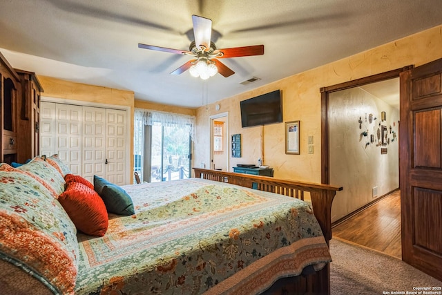 bedroom with hardwood / wood-style flooring and ceiling fan