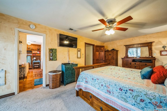 bedroom with ceiling fan and light carpet