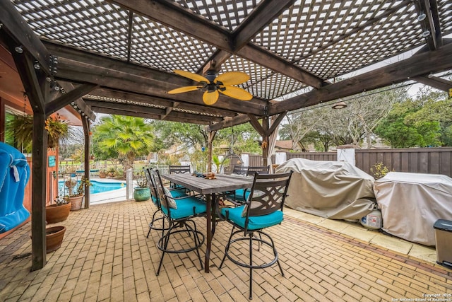 view of patio / terrace with a fenced in pool, ceiling fan, a grill, and a pergola