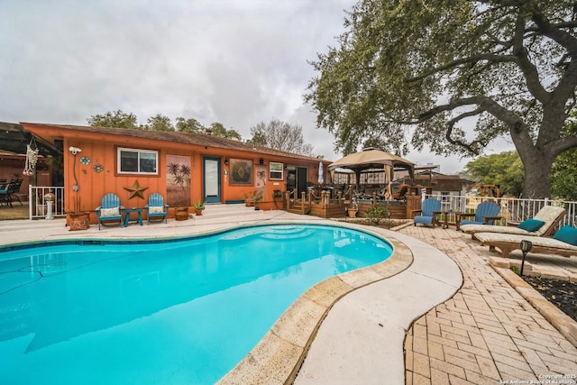 view of swimming pool featuring a gazebo