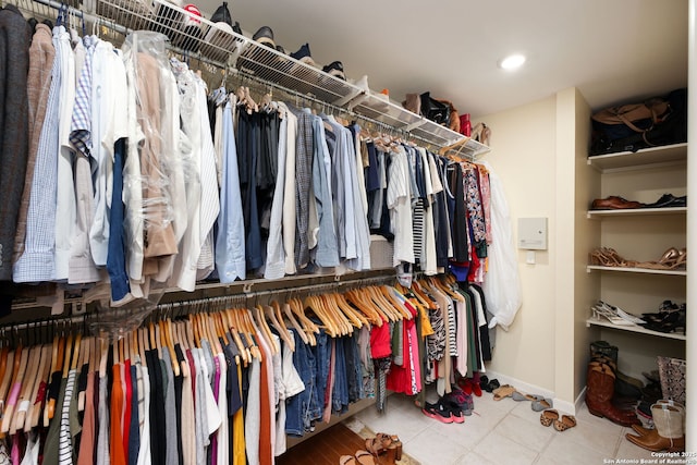 spacious closet featuring tile patterned floors