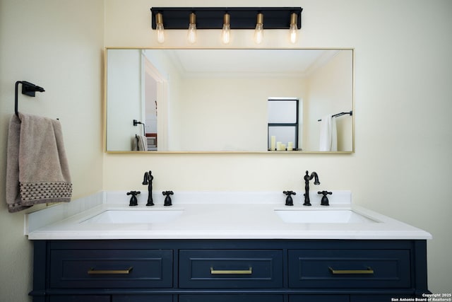 bathroom featuring crown molding and vanity