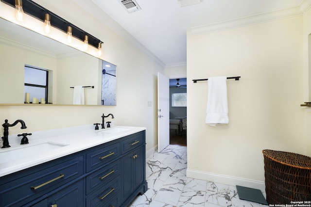 bathroom featuring ornamental molding and vanity