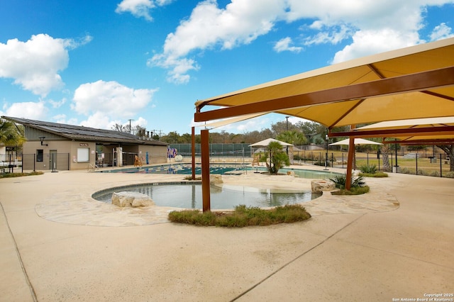 view of swimming pool featuring a patio area