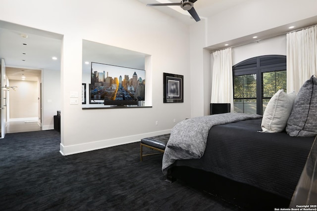 bedroom featuring ceiling fan and dark colored carpet