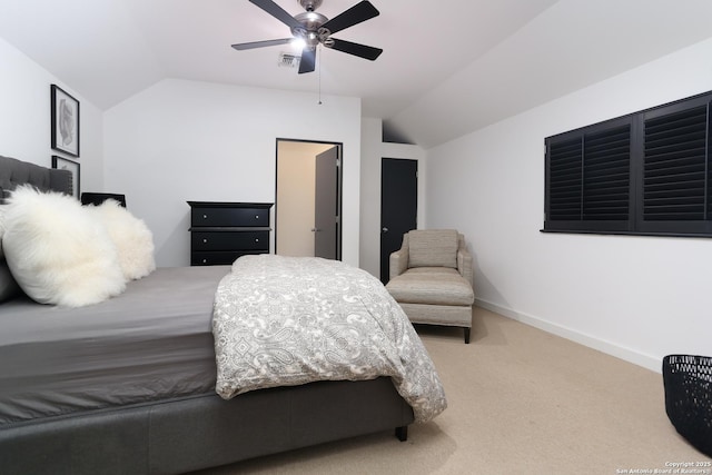 carpeted bedroom featuring vaulted ceiling and ceiling fan